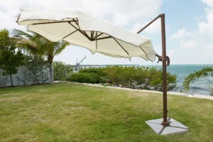 Panama Jack 10 FT DIA Cantilever Umbrella with stone bases